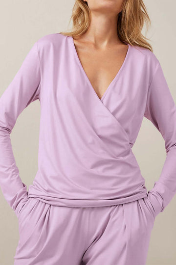 Stylish lavender wrap top for a sleek and fashionable outfit suitable for any occasion.