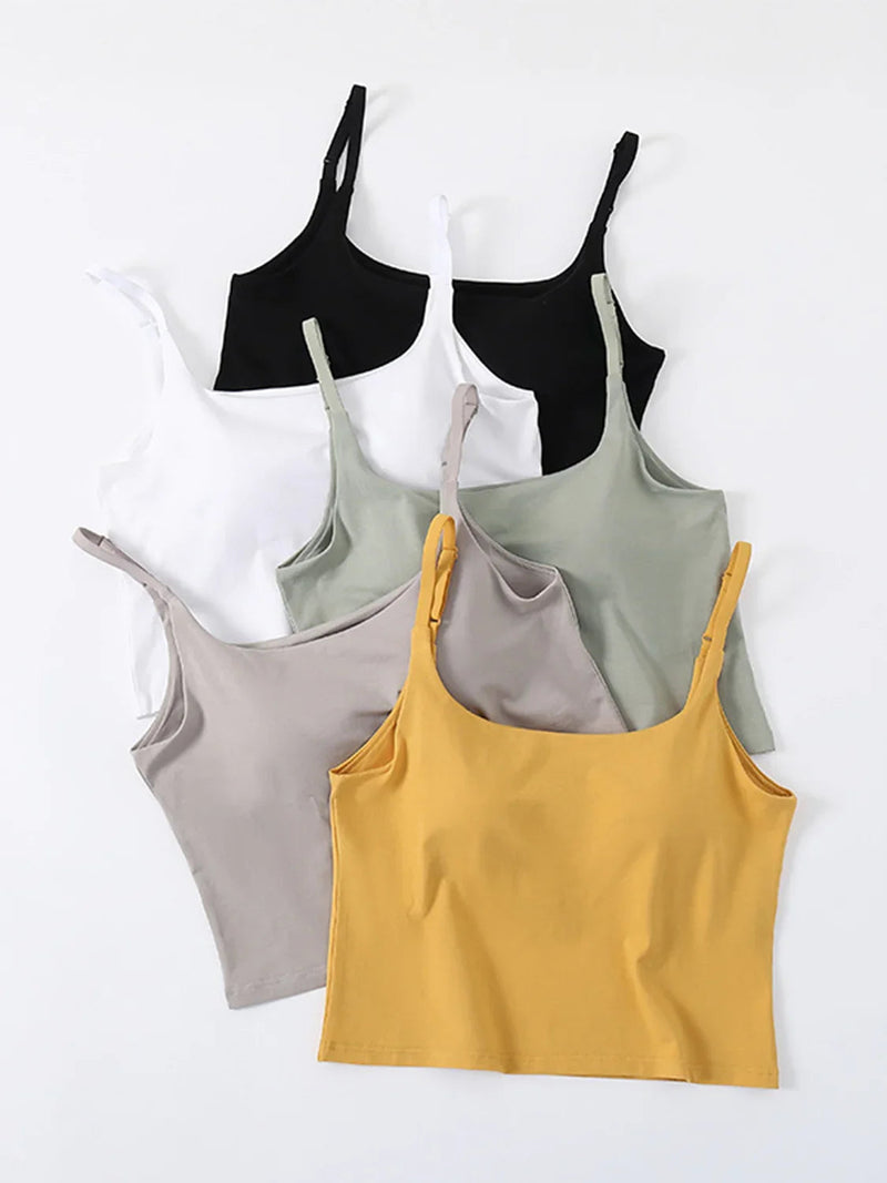 Womens tank tops in various colors including black, white, olive, gray, and yellow, perfect for layering and casual wear.