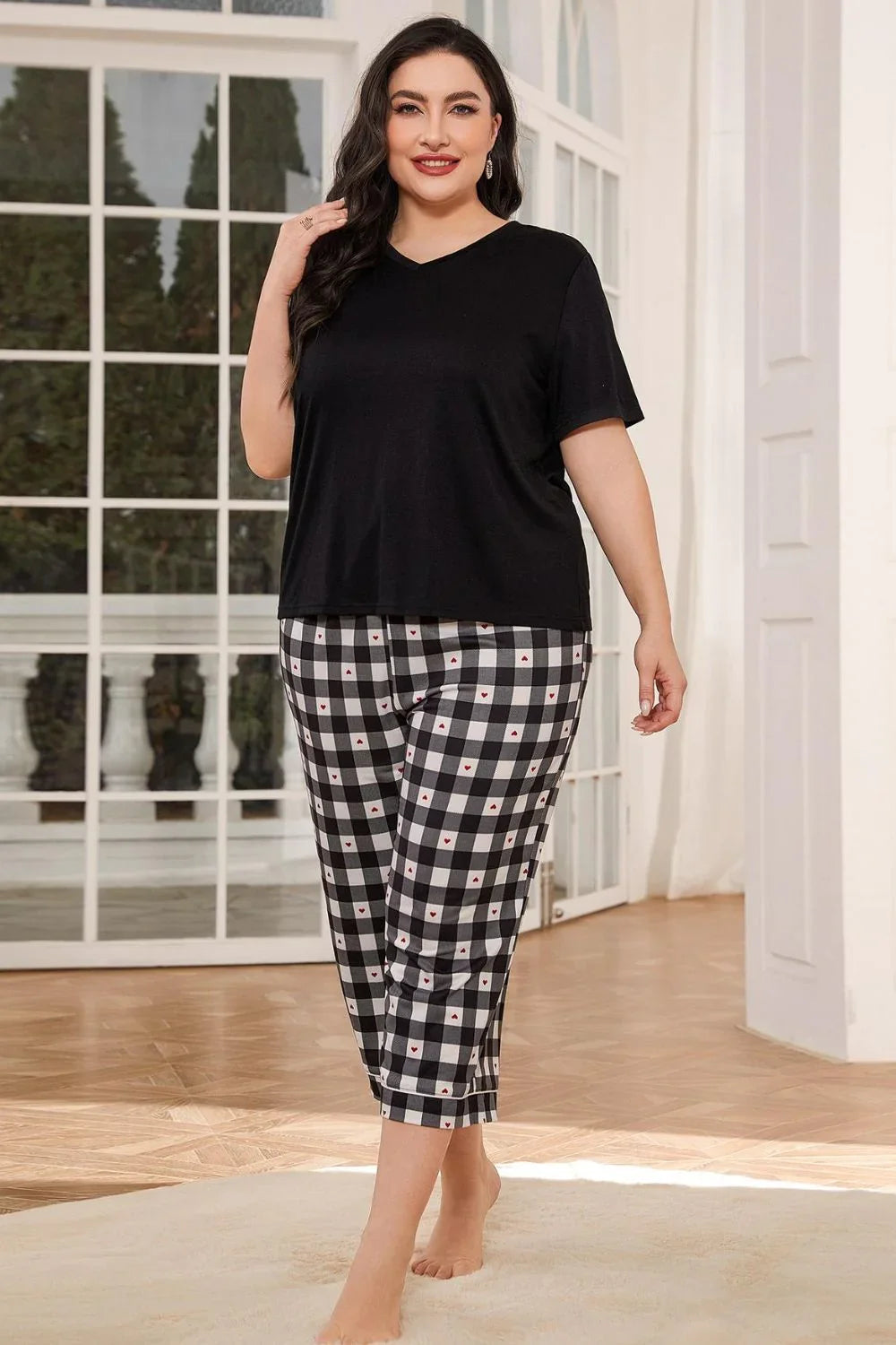 V-Neck Tee and Plaid Cropped Pants Lounge Set model wearing black V-neck tee with plaid cropped pants.