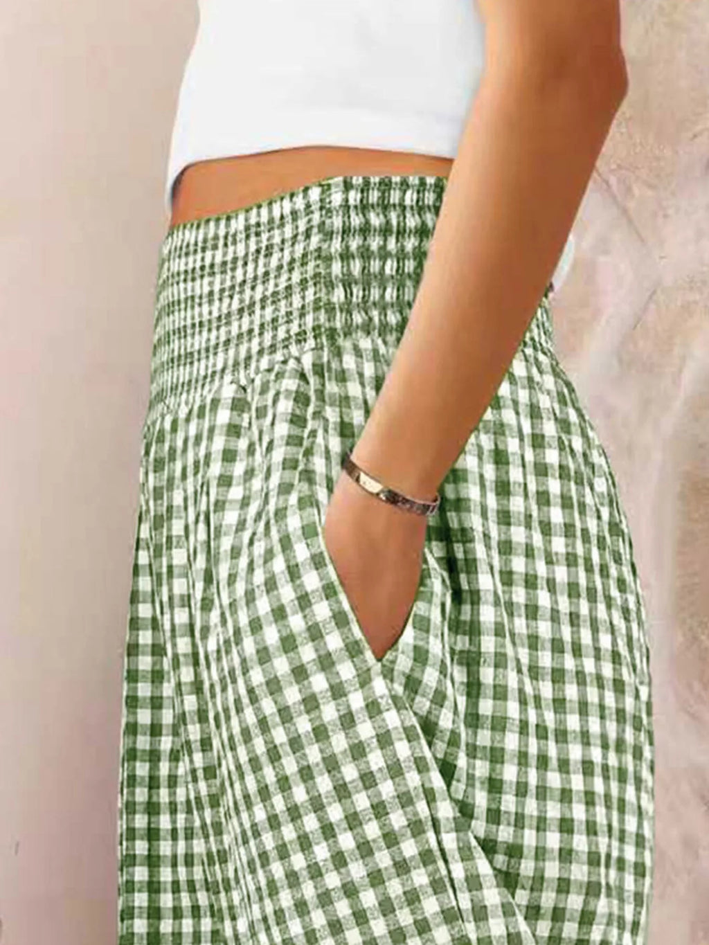 Gingham High-Waisted Wide Leg Pants showcasing a side view with pockets and smocked waistband, styled for comfort.