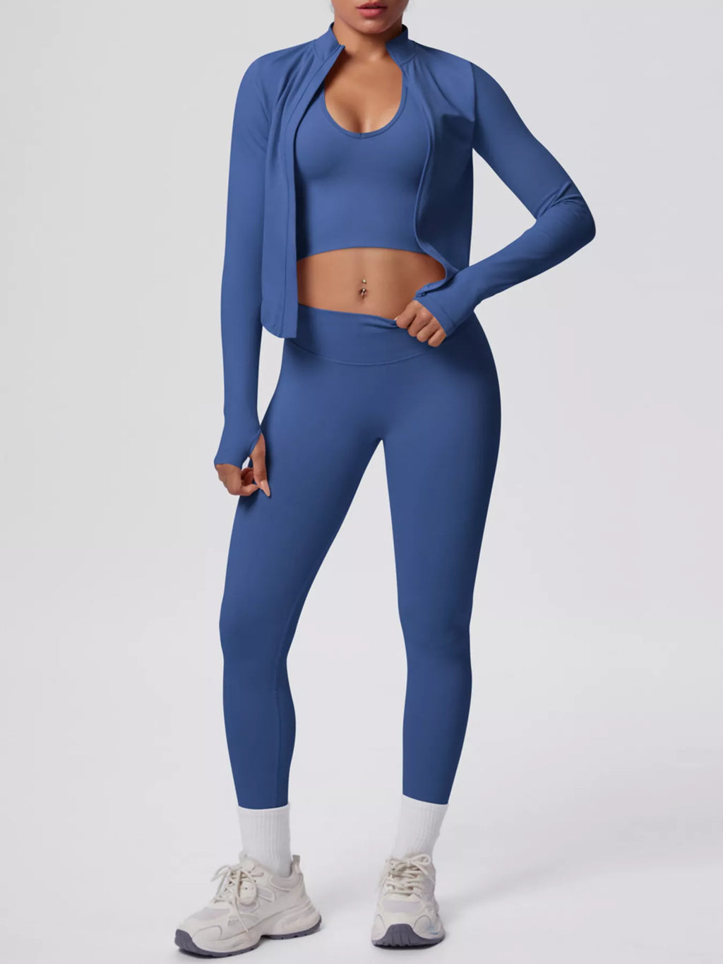 Stylish activewear featuring a blue tank top, zip-up jacket, and leggings, perfect for workouts and comfort.