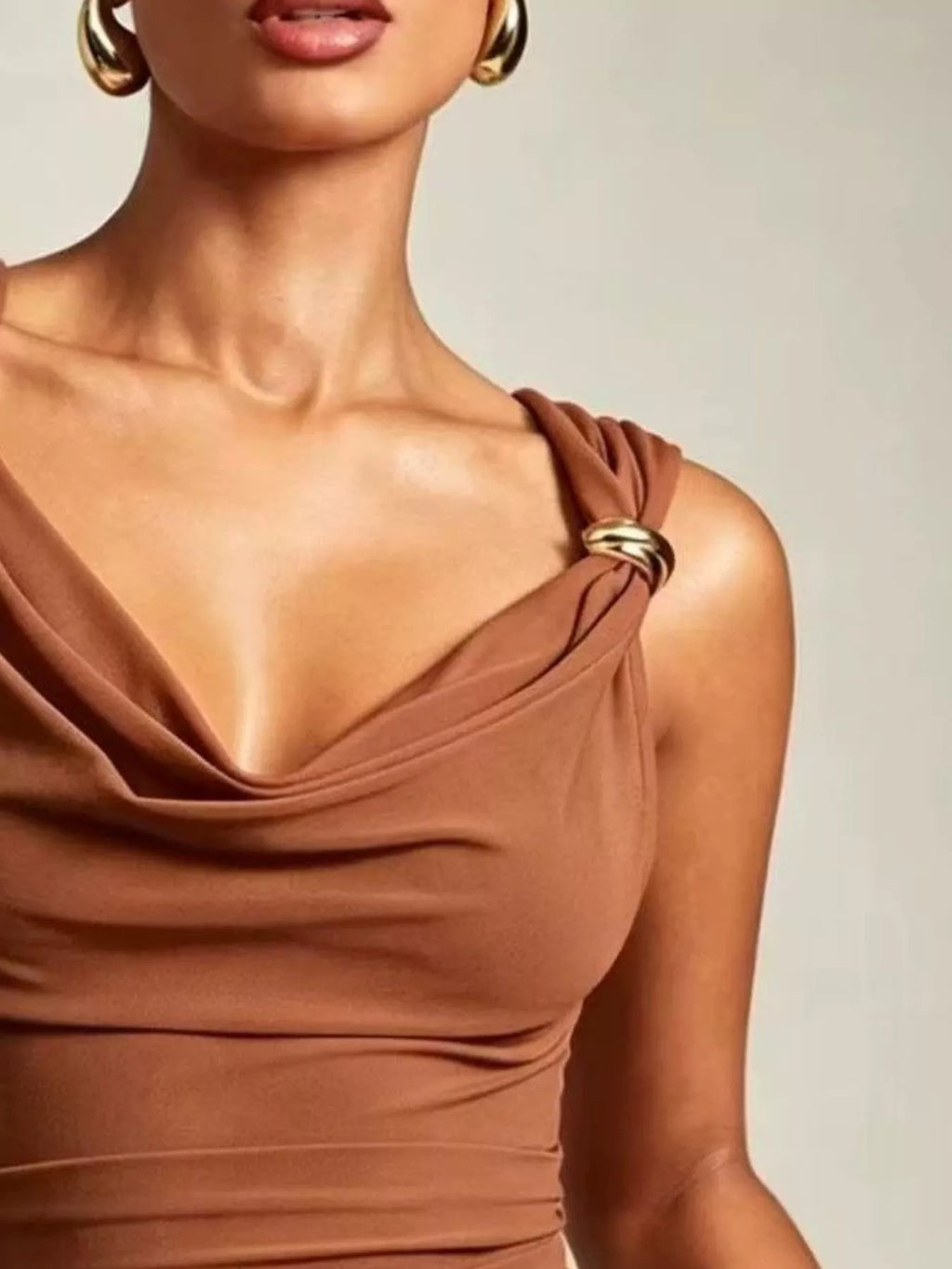 Cowl neck tank with metal ring accents, showcasing a stylish ruched stretch design in a rich brown color.