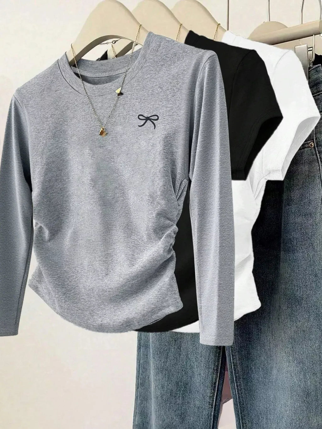 Cute Grey Bow Long Sleeve T-Shirt – Adorable Women’s Casual Top displayed with black and white tees.