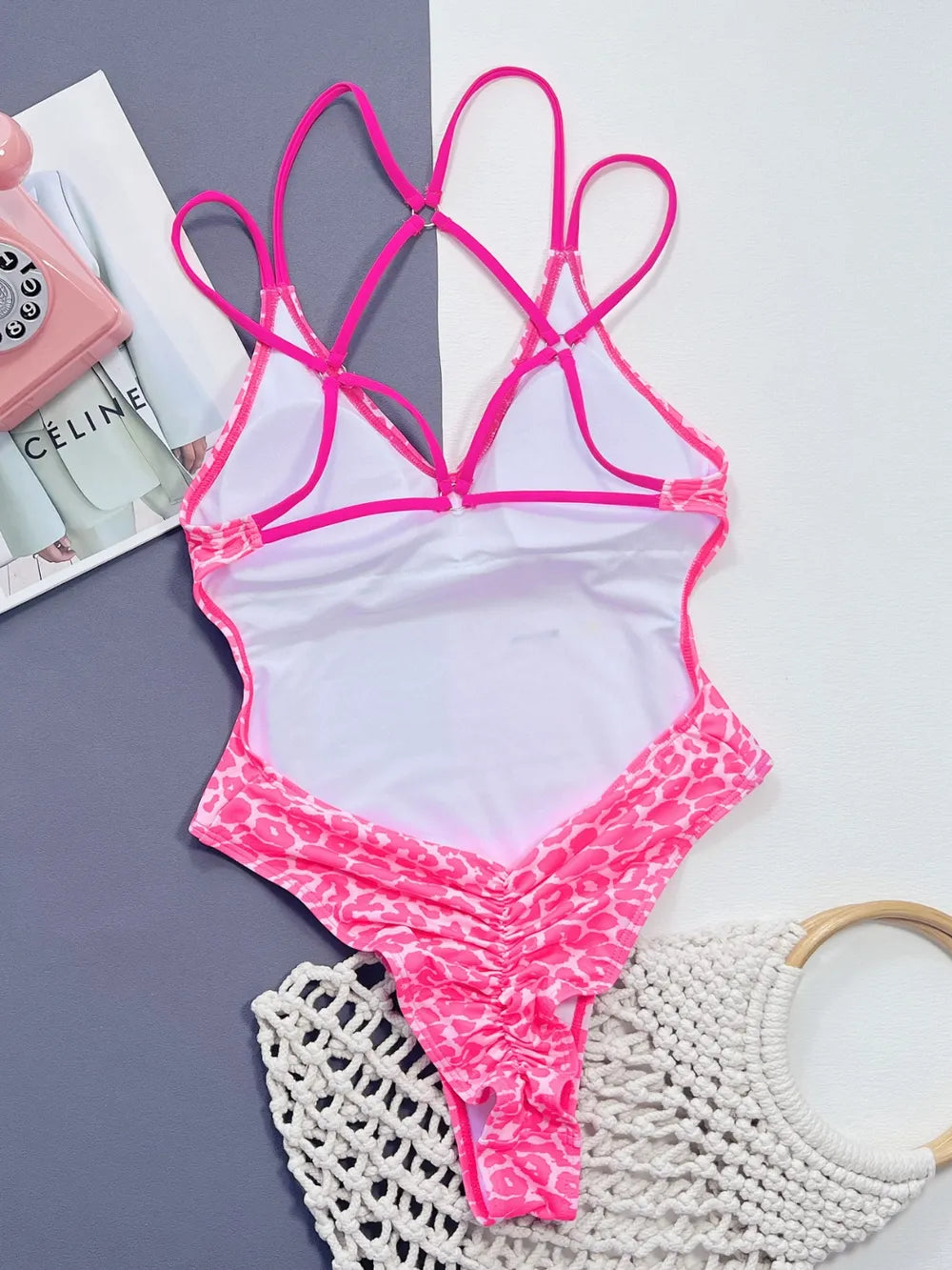 Fashionable swimwear - Leopard Plunge Thong Spaghetti Strap One-Piece in vibrant pink color, perfect for beach outings.