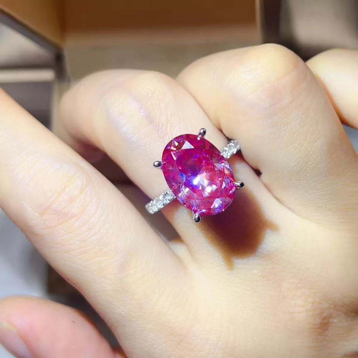 8 Carat Moissanite Oval 925 Sterling Silver Ring on a hand, showcasing its brilliance and elegance.