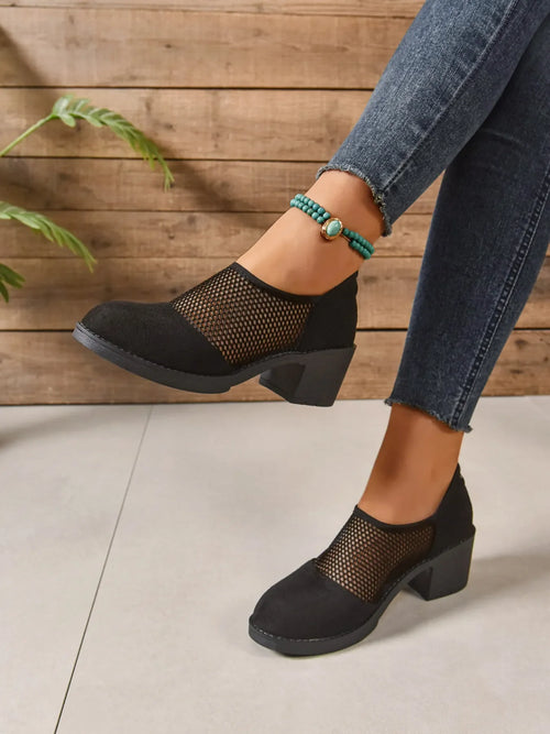 Black Mesh Panel Block Heel Pumps worn with denim, showcasing breathable mesh design and stylish block heel.