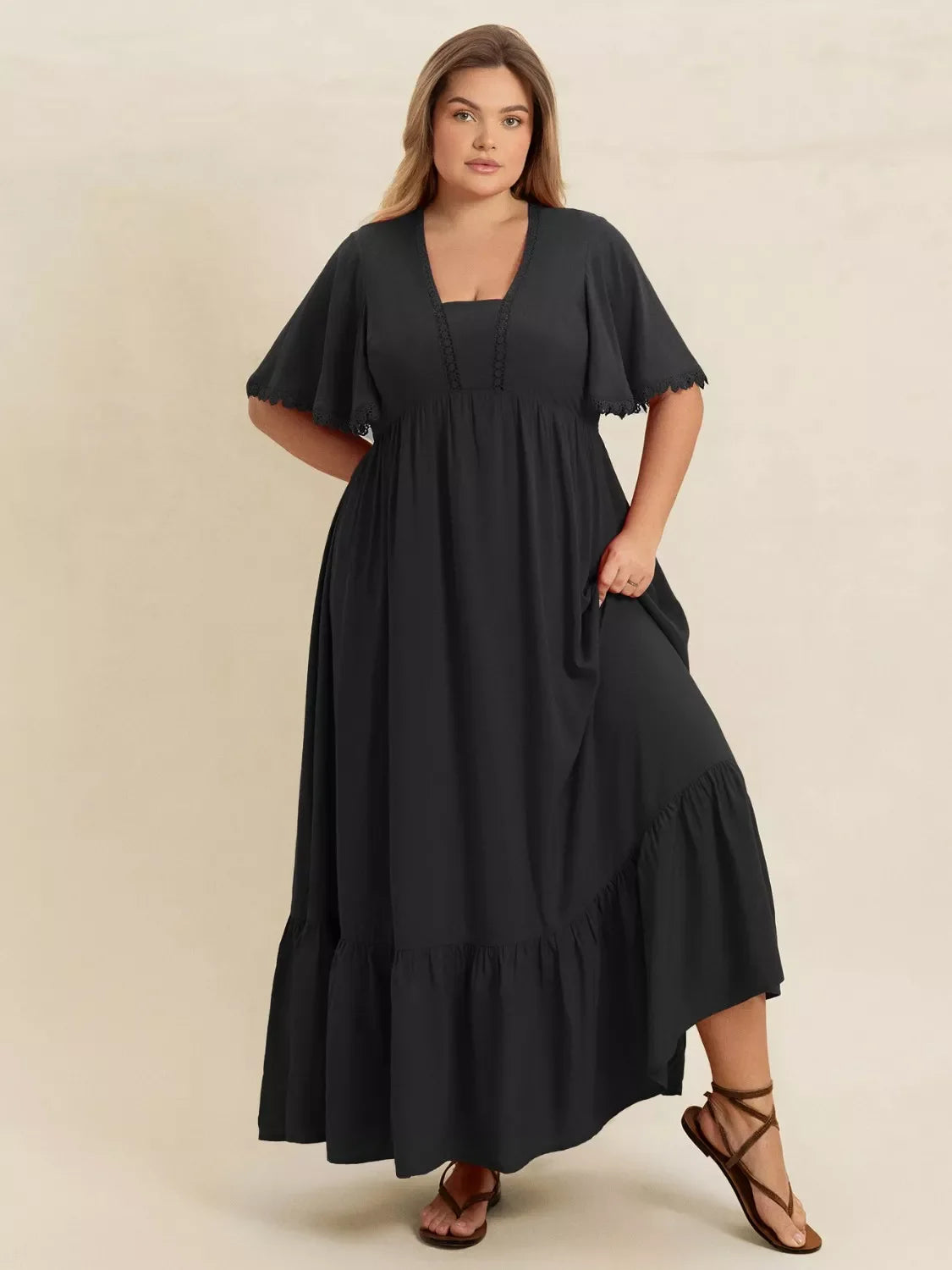 Plus Size Boho Ruffled Maxi Dress with Flutter Sleeves in black, featuring flutter sleeves and a tiered ruffle hem.