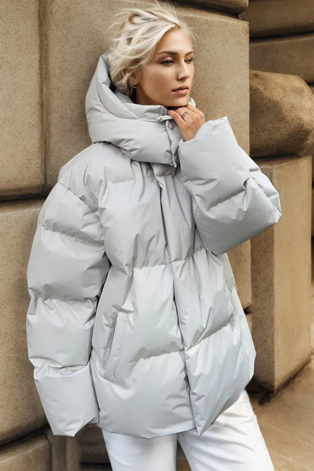 Pocketed Zip Up Hooded Puffer Jacket – Women’s Warm Winter Outerwear in light grey, styled with a cozy hood and puffer design.