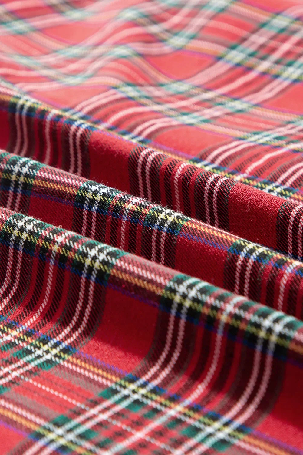 Plus Size Plaid Collared Neck Top and Pants Lounge Set fabric close-up showing vibrant red plaid design.