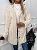 Cream Fuzzy Button Down Hooded Coat – Women’s Cozy Winter Outerwear modeled with a white top and black handbag.