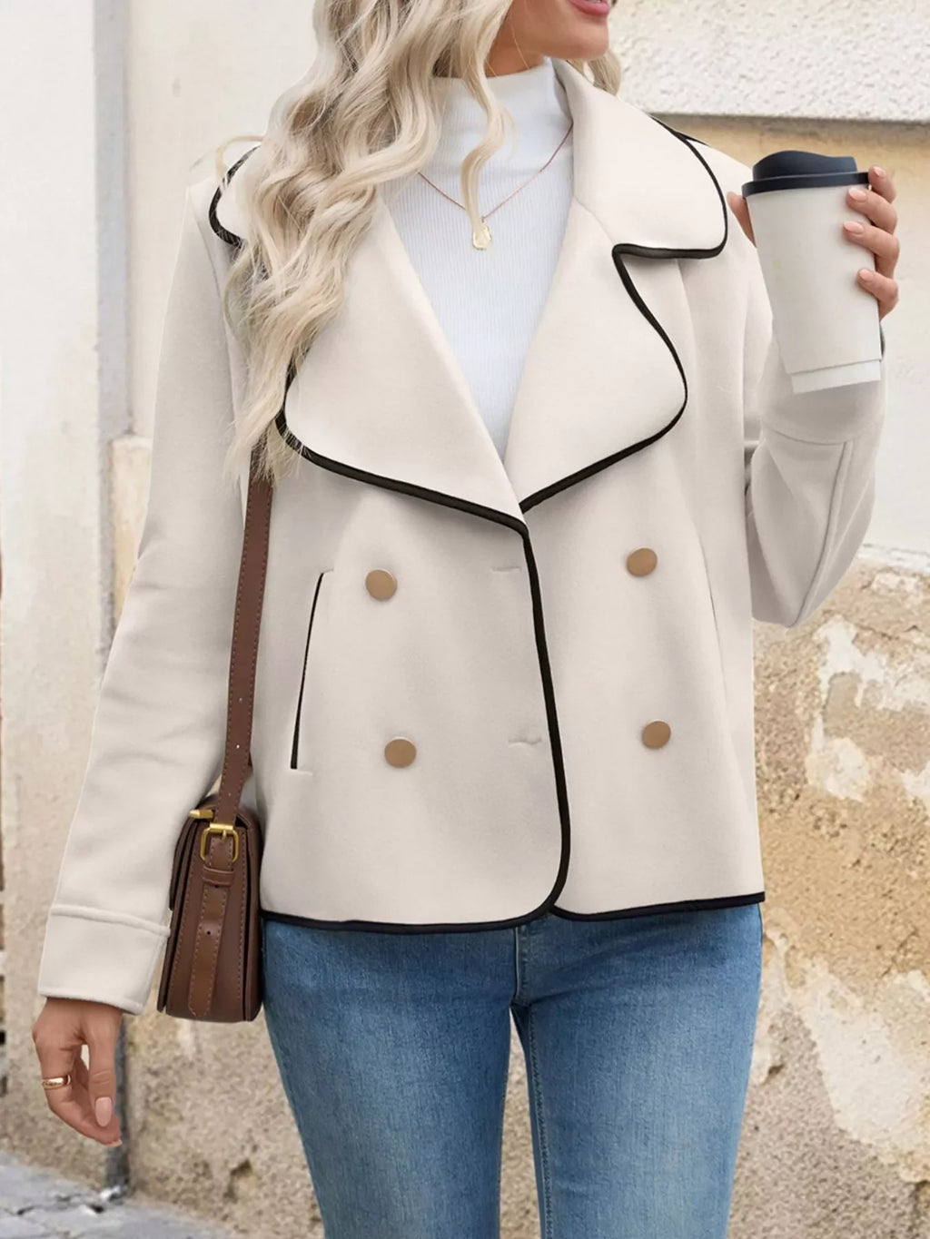 Woman wearing a Contrast Trim Double-Breasted Jacket, holding a coffee, showcasing style and sophistication.