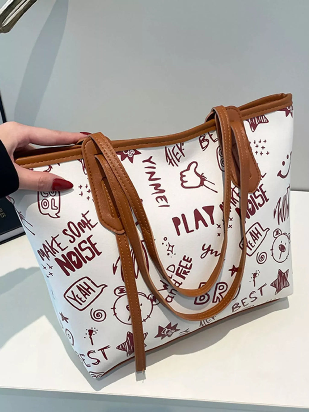 Graffiti Print Tote Bag – Large Canvas Shoulder Bag for Women with colorful graphics and brown straps.