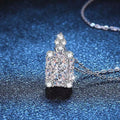 Moissanite jewelry 1 carat pendant necklace on a blue background, showcasing brilliance and elegance.