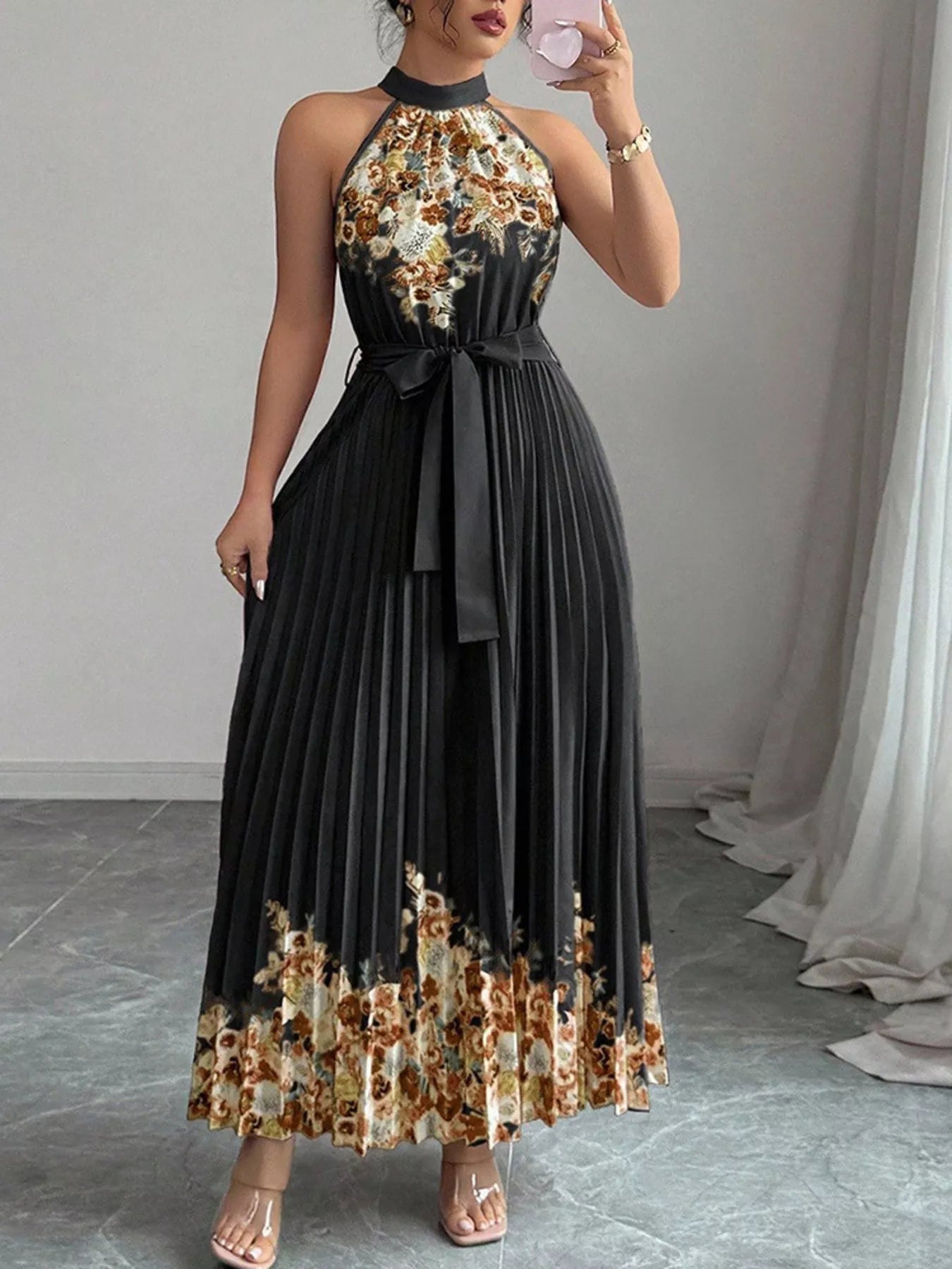 Summer Maxi Dress - Halter Neck Floral Print Pleated design model showcasing elegance in a warm-weather outfit.