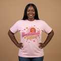 Woman wearing a pink Basketball Mom Shirt with basketball and heart designs.