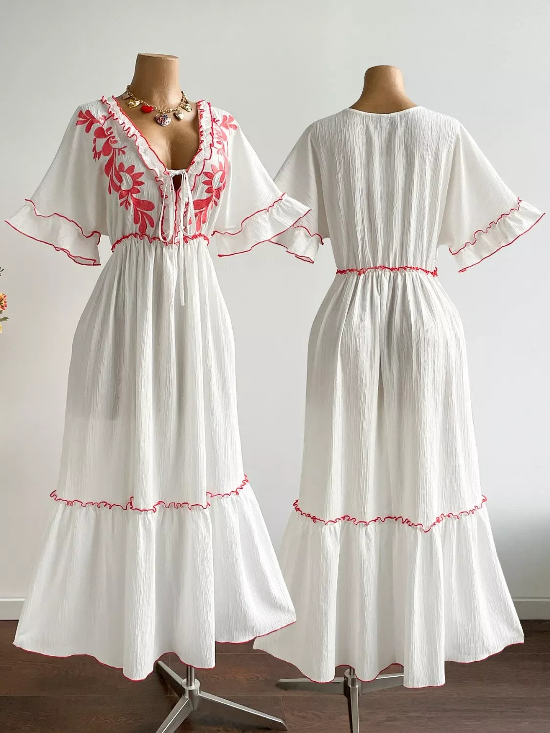 Plus Size Front Tie Maxi Dress with Floral Embroidered displayed on a mannequin, showcasing front tie detail and floral designs.