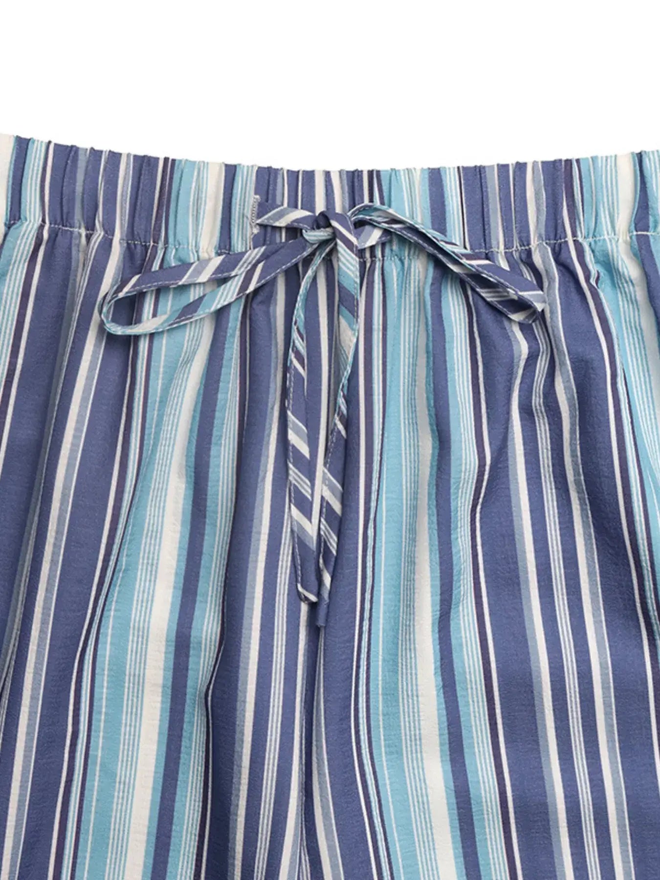 Close-up view of the waist tie of Striped Wide-Leg Pants (Midnight Blue) showcasing beautiful blue stripes.