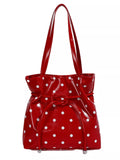 Red polka dot bag over shoulder made from durable PU leather, perfect for casual and formal events.