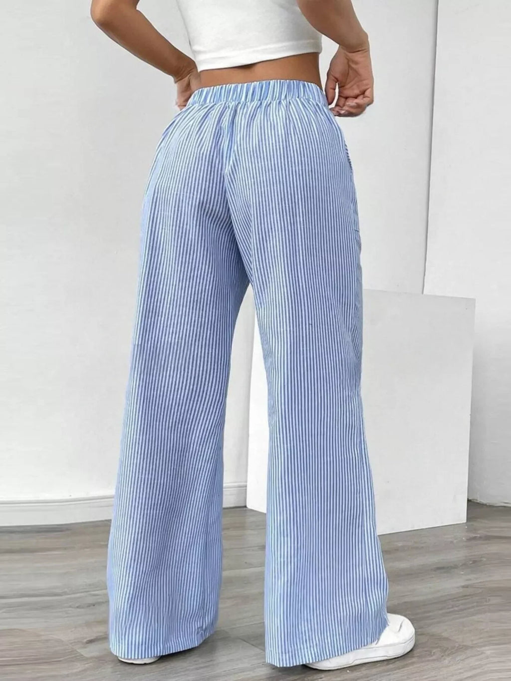 Striped Wide Leg Pants featuring a comfortable fit with pockets and a stylish blue and white stripe pattern.