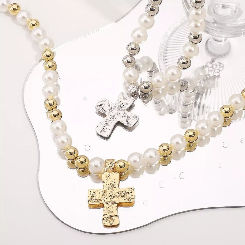 Elegant pearl cross pendant necklace featuring gold and silver crosses with freshwater pearls, perfect for any occasion.