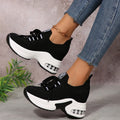 Lace Up Platform Sneakers with bold white sole and stylish black knit upper, perfect for casual and trendy outfits.
