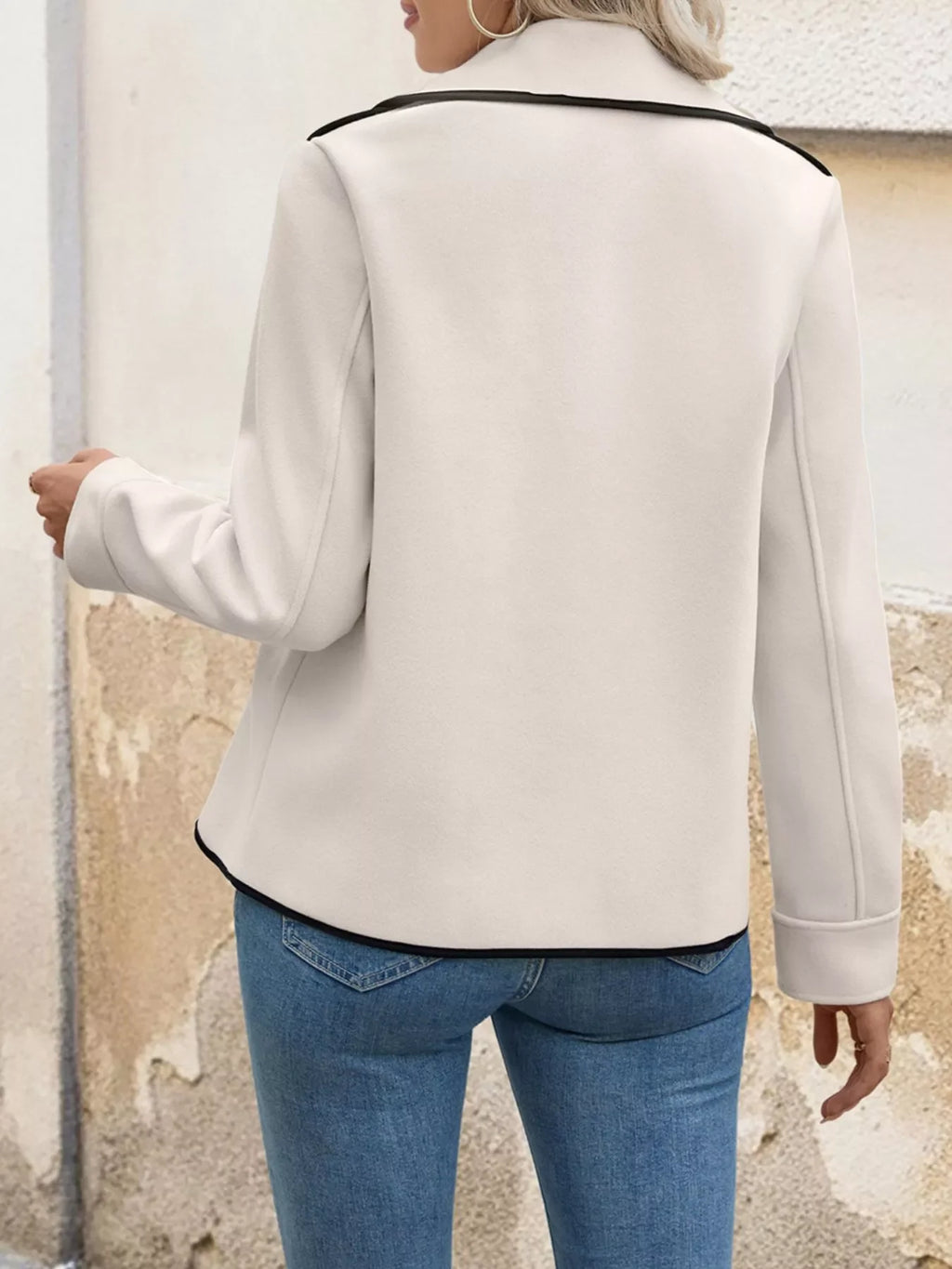 Back view of a woman wearing a Contrast Trim Double-Breasted Jacket, showcasing its stylish design and contrast trim.