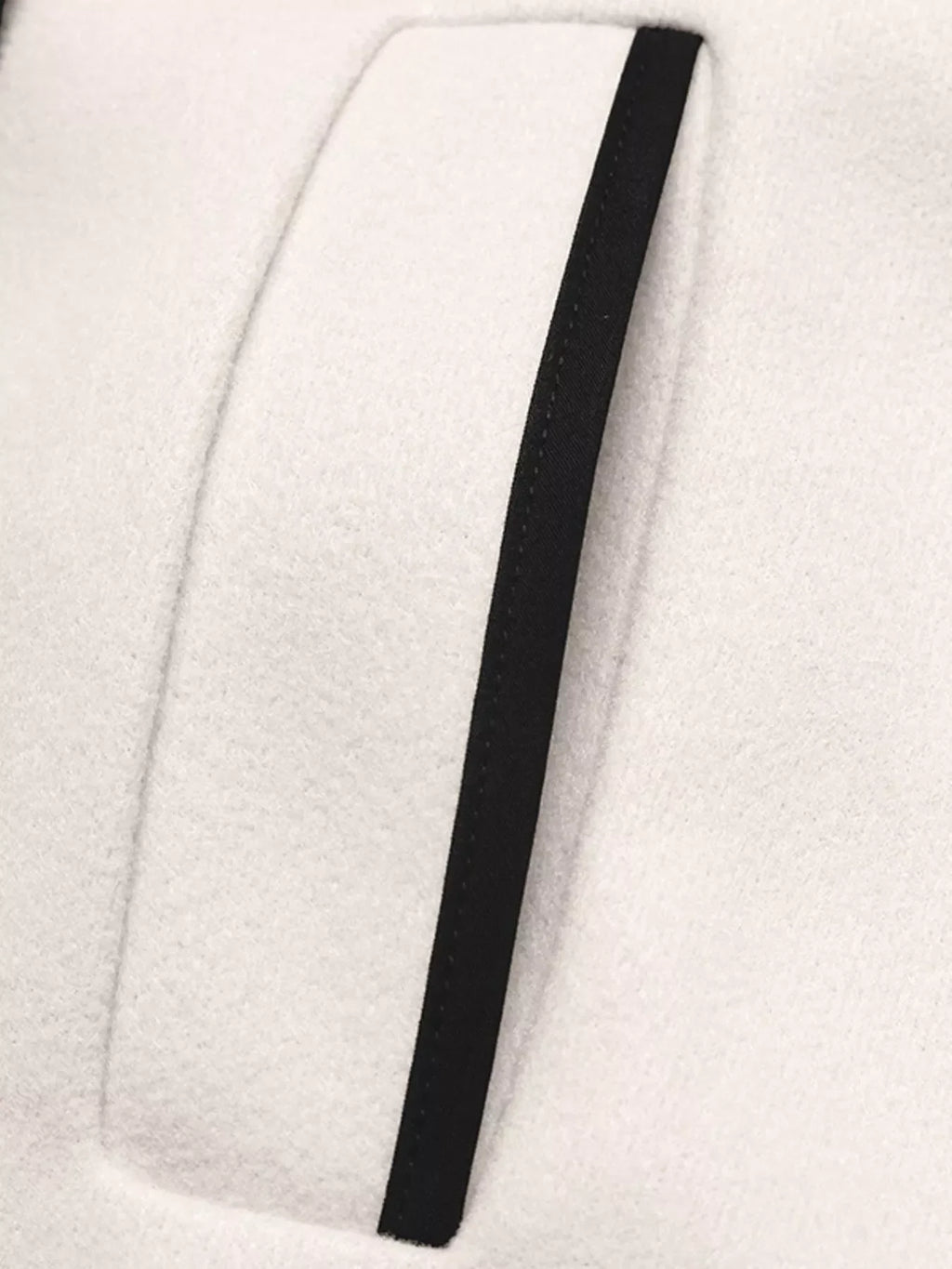Close-up of the contrast trim on the Contrast Trim Double-Breasted Jacket, showcasing its stylish design.