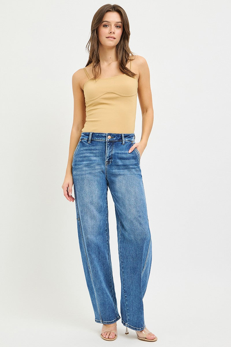 Model wearing Blue Slouchy Baggy Jeans with a beige tank top, showcasing a relaxed street-style look.