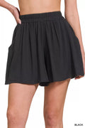 Diamond Black Woven Elastic Band Shorts With Pocket displayed on a model, showcasing stylish design and comfort.