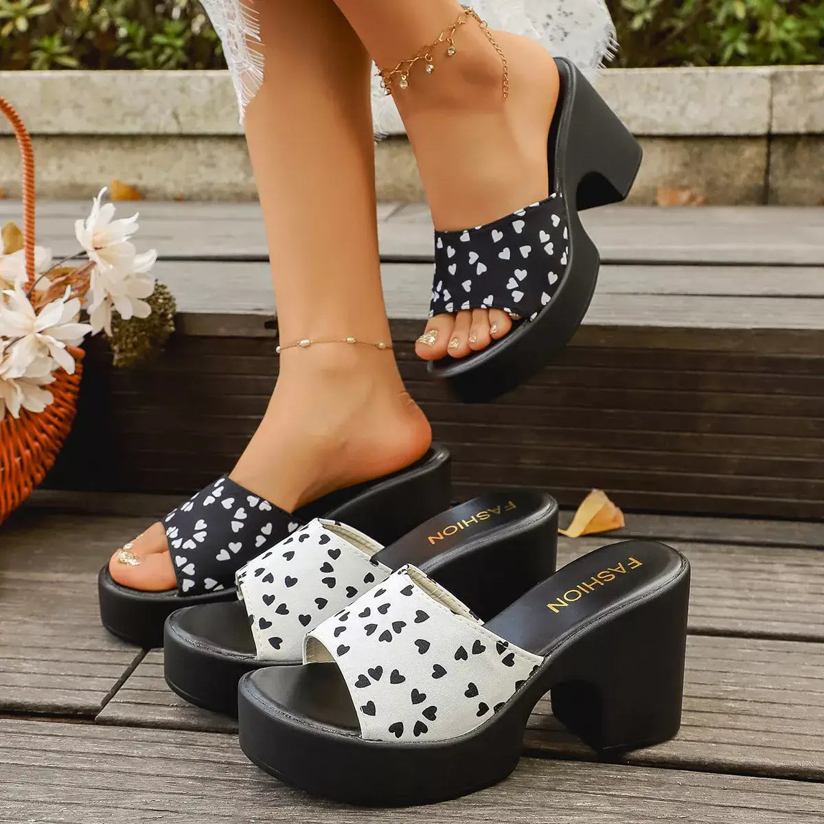 Block Heel Sandals Sweetheart Print on a stylish display with flirty heart patterns in black and white.