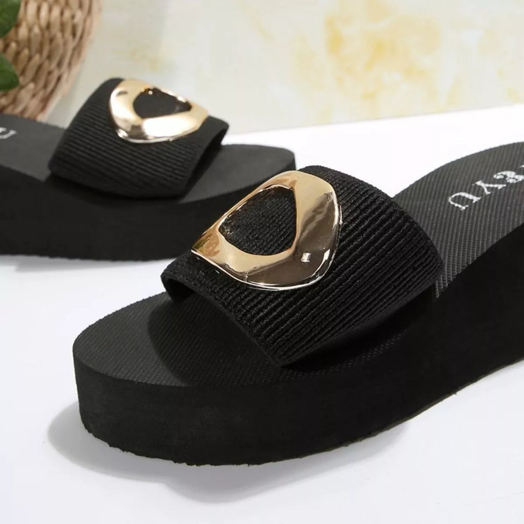 Open toe platform sandals with a stylish gold accent, perfect for fashion-forward wardrobes.
