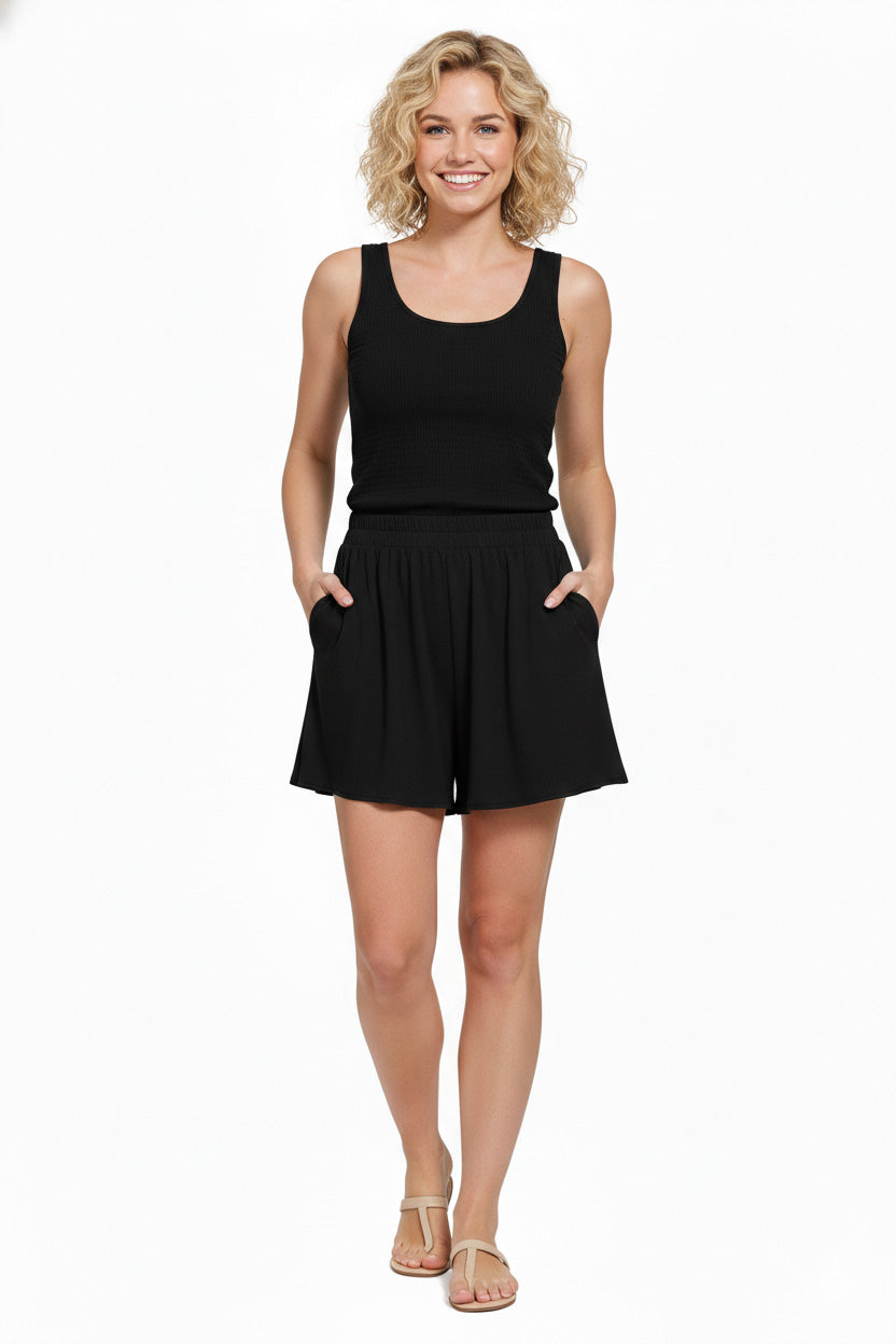 Diamond Black Woven Elastic Band Shorts With Pocket worn by a model, featuring a relaxed fit and stylish design.