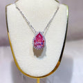 925 sterling silver pendant necklace featuring a stunning pear-shaped pink Moissanite stone.