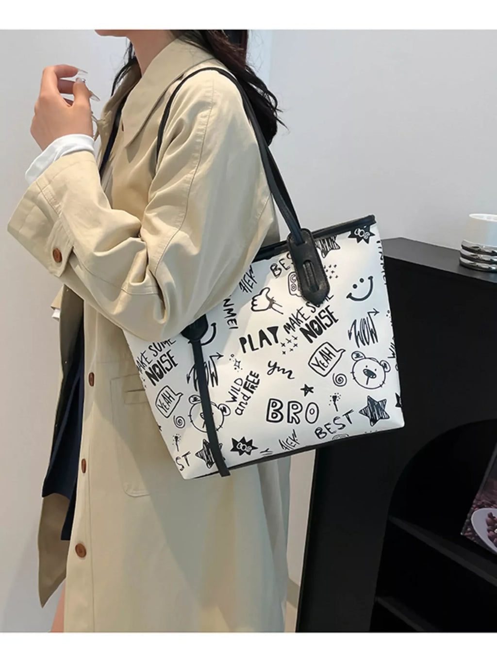 Graffiti Print Tote Bag – Large Canvas Shoulder Bag for Women held by a woman in a stylish outfit.
