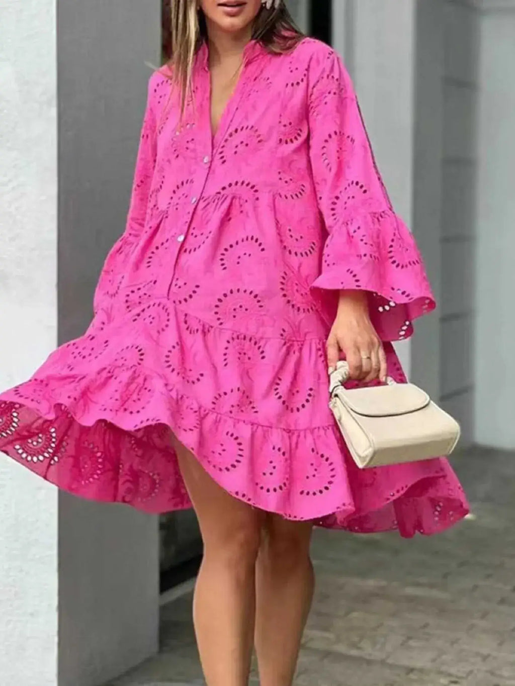 Plus size summer dress featuring vibrant pink eyelet fabric, V-neck design, and ruffled hem, perfect for summer style.