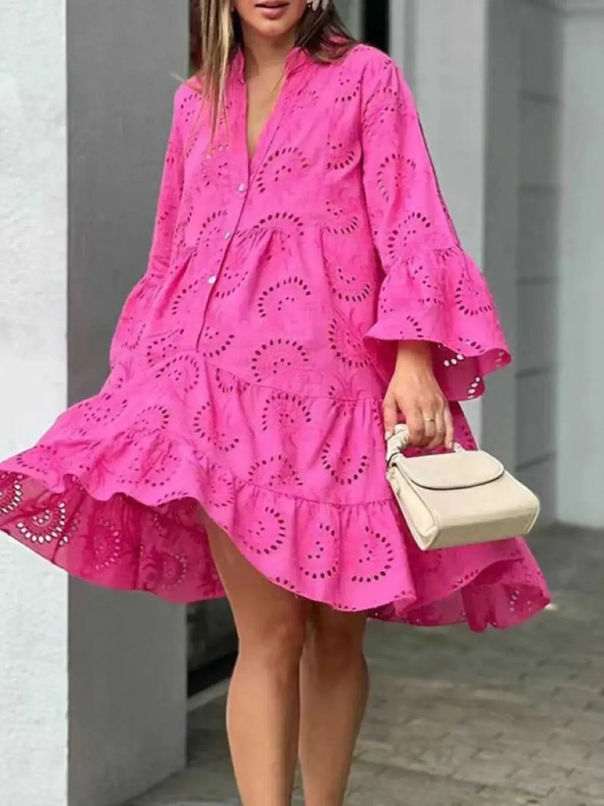 Plus size summer dress featuring vibrant pink eyelet fabric, V-neck design, and ruffled hem, perfect for summer style.