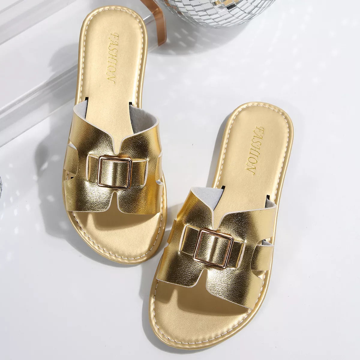 Stylish Women's Slide Sandals with elegant buckle in gold finish, perfect for summer occasions.