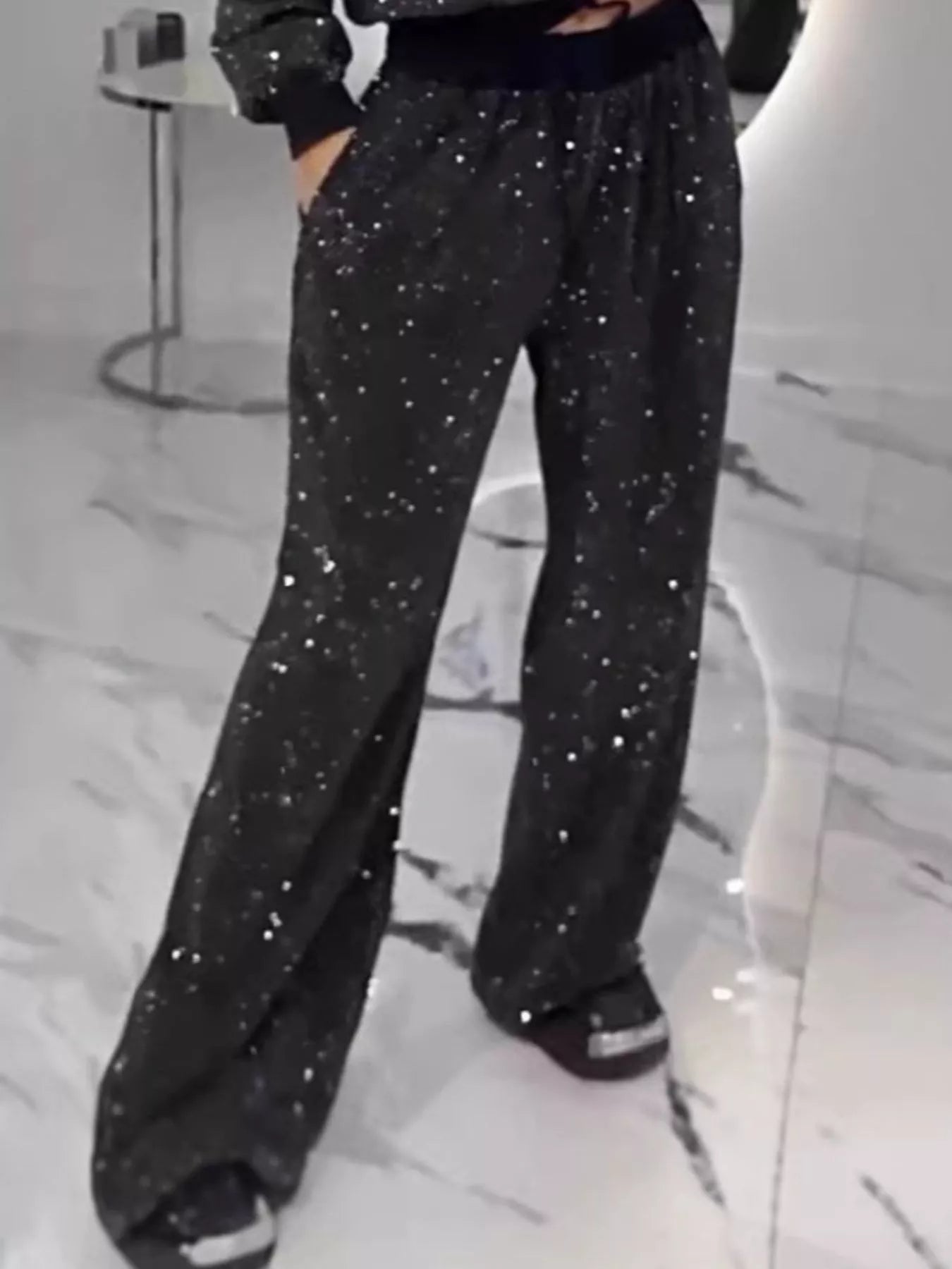 Rhinestone two-piece set featuring stylish pants with pockets, slightly stretchy material, and a shimmering design.