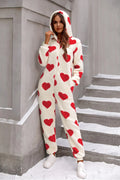 Fuzzy heart lounge jumpsuit featuring a cozy zip-up design and hood, perfect for lounging in style.