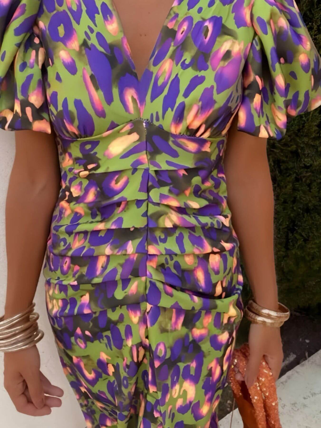 Plus size puff sleeve midi dress featuring vibrant green and purple leopard print design with stylish V-neck.