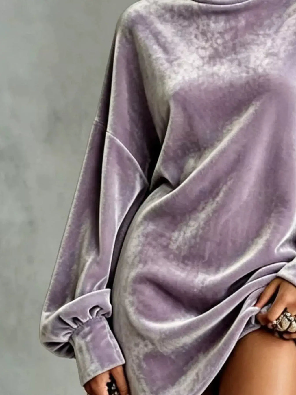 Plus size velvet mini dress in soft lavender color, featuring long sleeves and a stylish oversized fit.