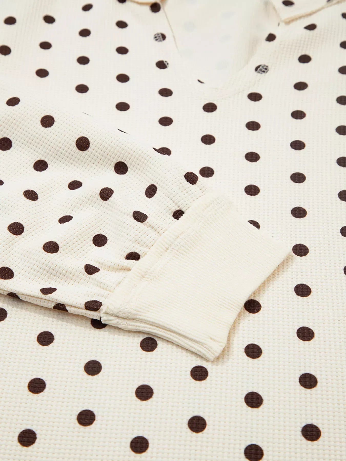 Polka Dot Notched Long Sleeve Top and Drawstring Joggers Lounge Set featuring a close-up of the polka dot pattern.