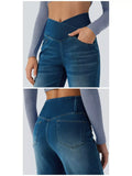 Model wearing high-waisted crossover jeans showcasing the unique crisscross design and stylish wash.
