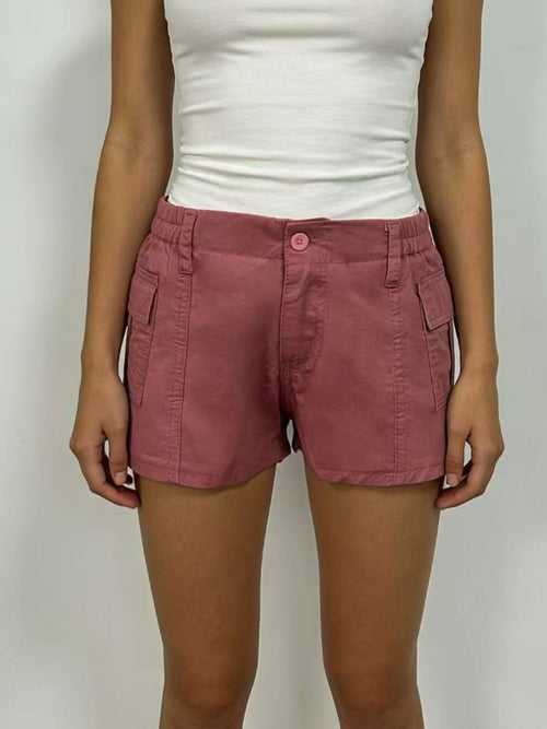 Casual Pocketed Shorts in soft pink color, featuring functional pockets and a comfortable design.