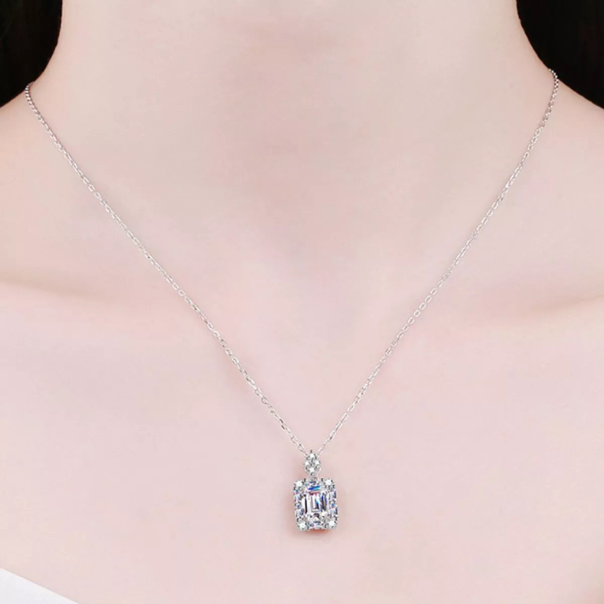 Moissanite jewelry 1 carat 925 sterling silver pendant necklace worn elegantly.