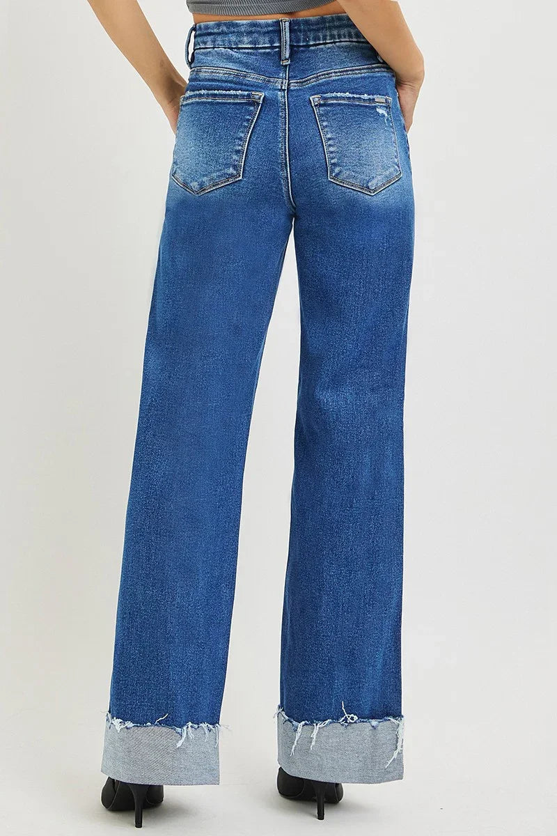 Blue Wash High Rise Wide Leg Jeans showcasing a relaxed silhouette and cuffed hems from the back view.