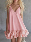 Plus size mini dress in pink with V-neck and bubble hem, featuring ruffles, perfect for casual wear.