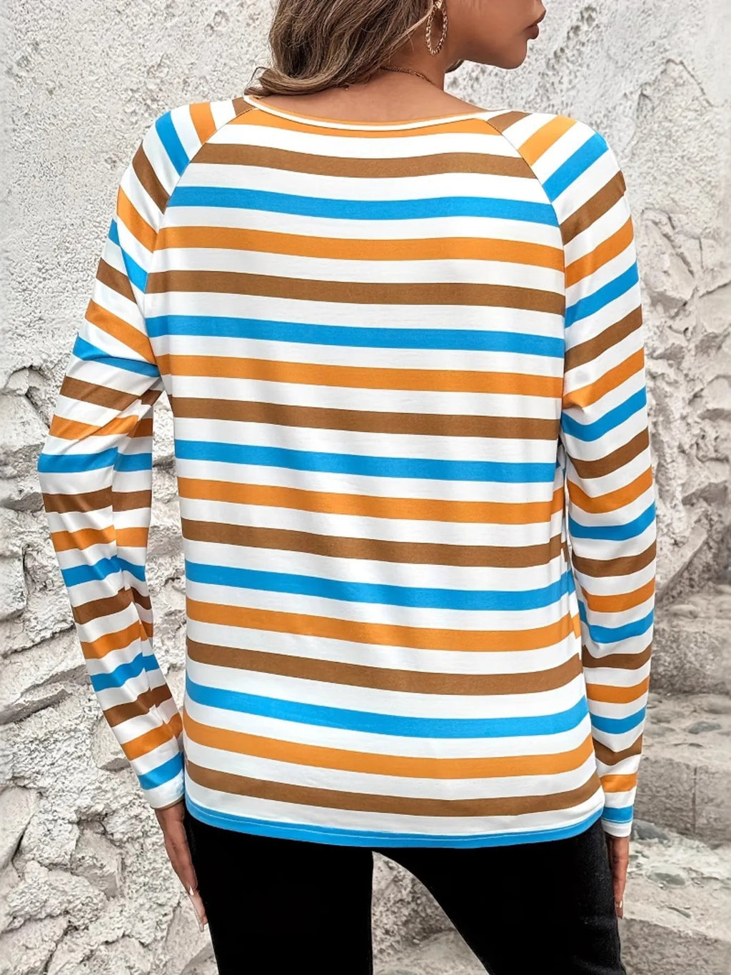 Casual wear for plus size women featuring a striped long sleeve shirt in brown, blue, and white colors.
