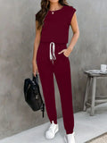 EmpowerEase Sleeveless Drawstring Jumpsuit in burgundy, stylish and comfortable for women's casual wear.