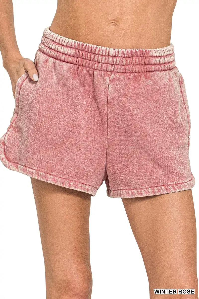 Acid Washed Dolphin Shorts in Winter Rose showcasing a stylish and comfortable design with an elastic waistband.